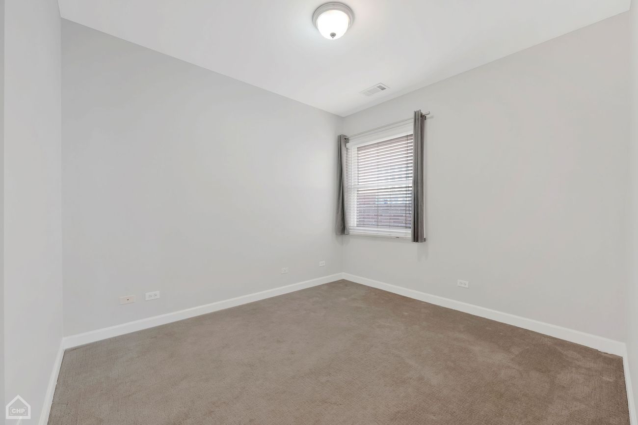 Damen Ave Condo — second bedroom with carpet
