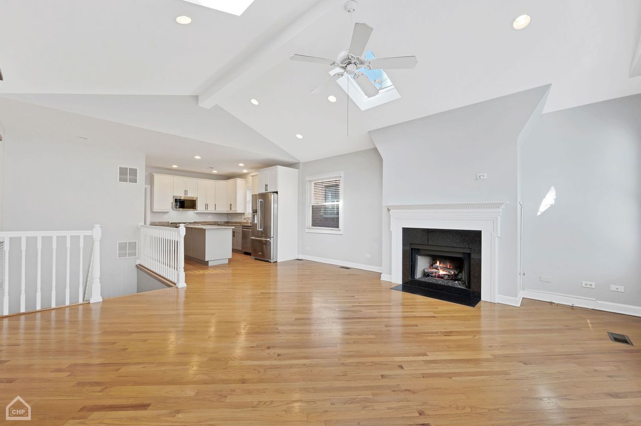 Damen Ave Condo — open living and kitchen area, wide view