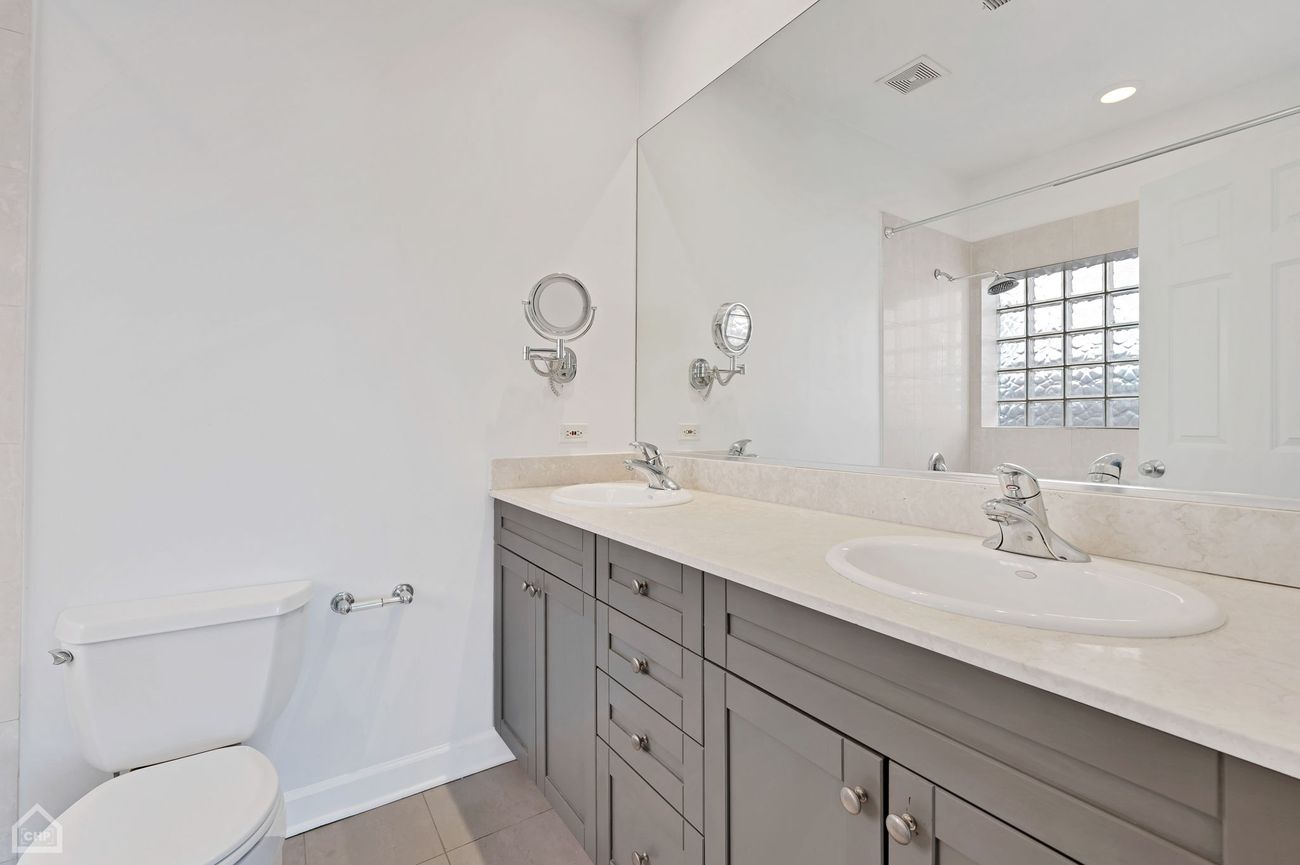 Damen Ave Condo — primary bathroom with double vanity