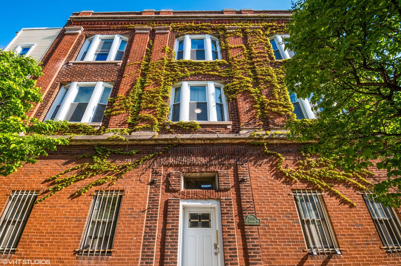 Ivy-covered vintage brick exterior of The Evergreen
