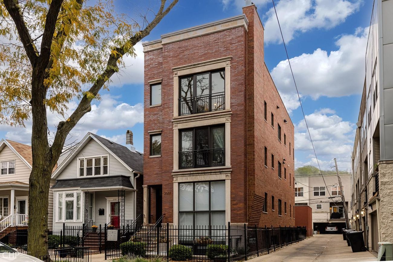 Exterior of the Logan Square 2BD brick building