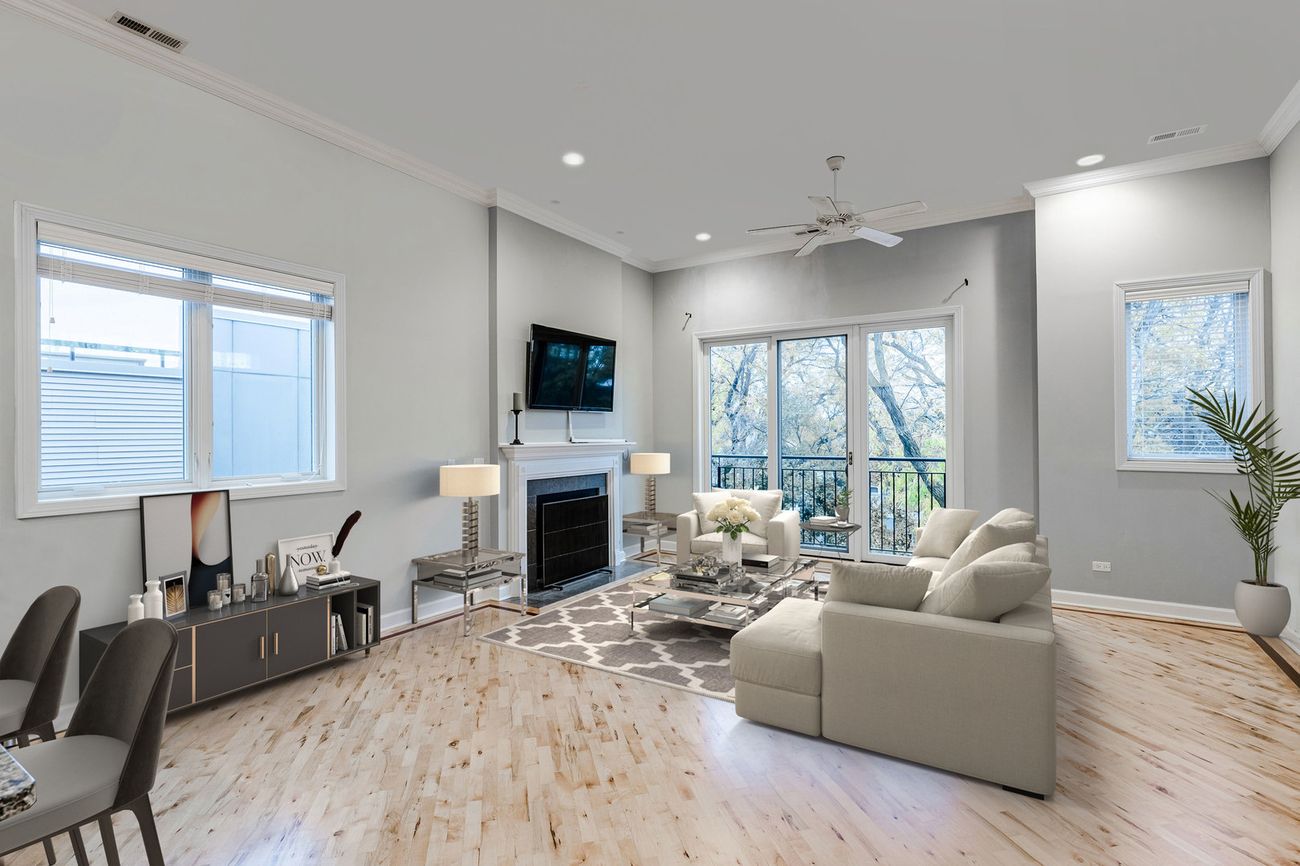 Logan Square 2BD — living room with fireplace and balcony doors