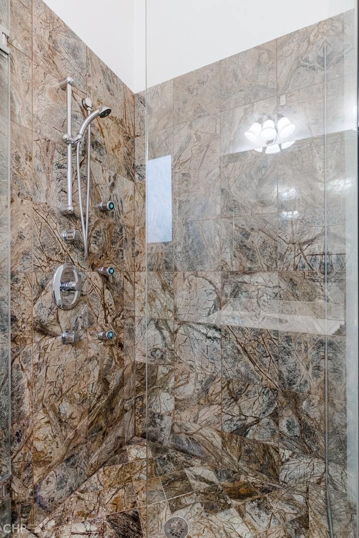Logan Square 2BD — primary bath glass shower detail