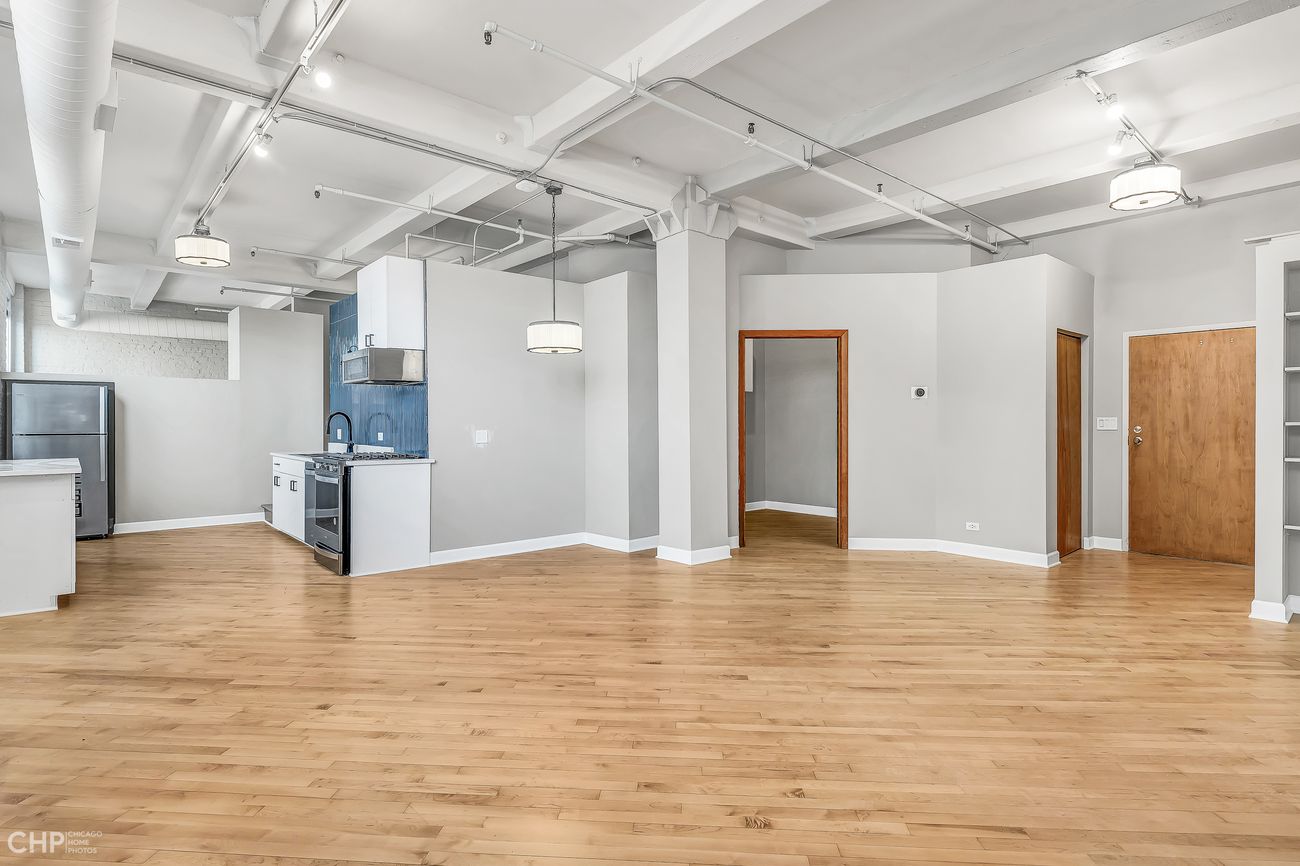 Sangamon Loft 1 — living area with view toward bedrooms and entry