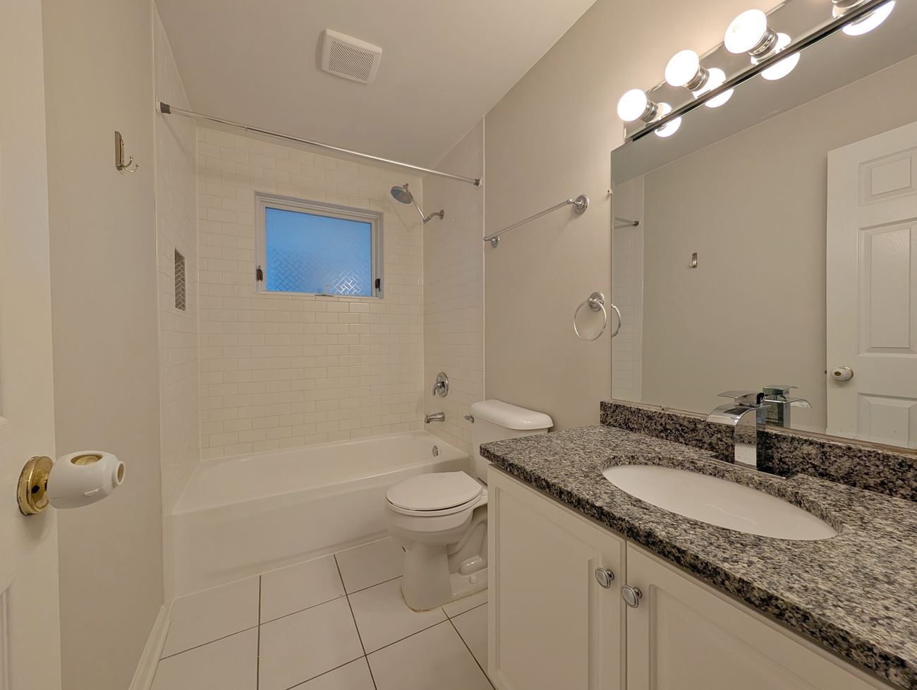 Walton Street Fourplex — unit bathroom with subway tile shower