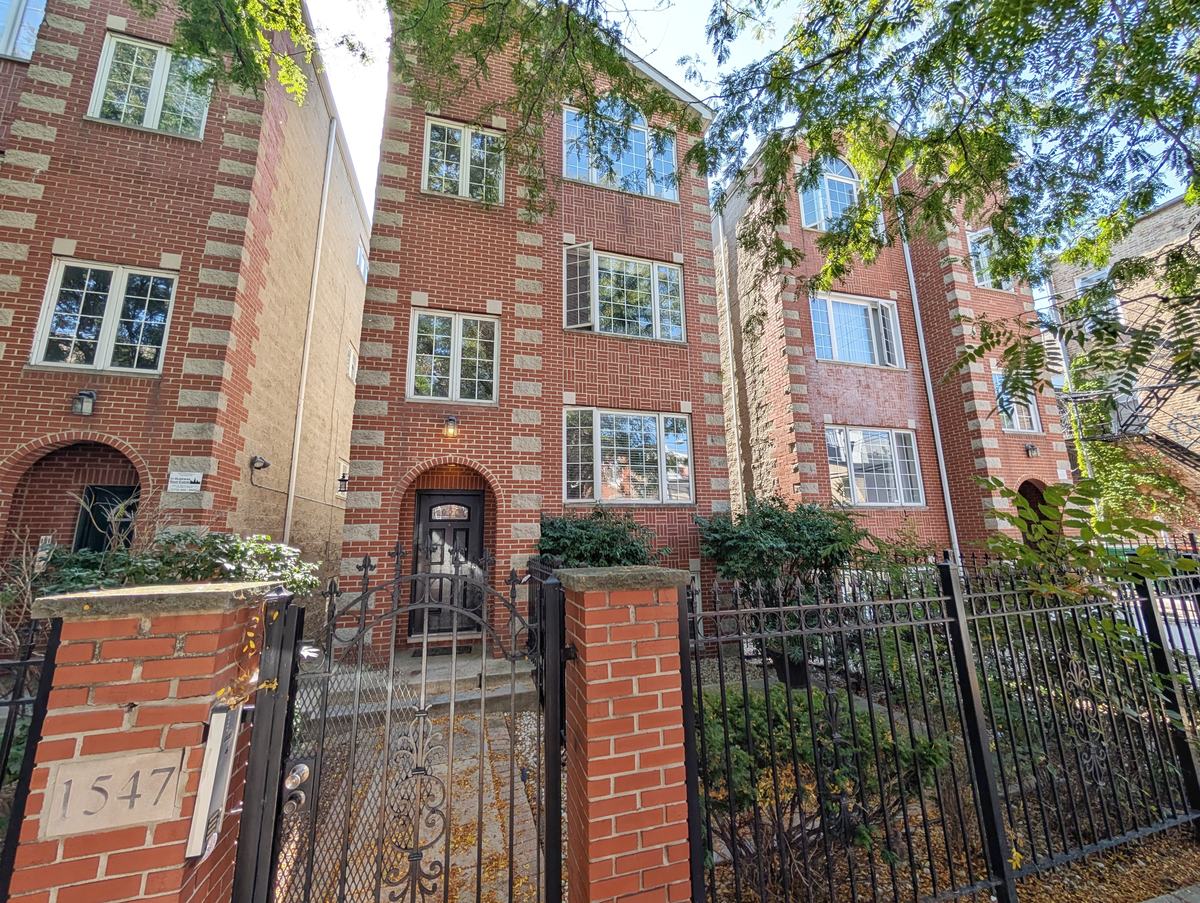 Exterior of the Walton Street Fourplex brick building