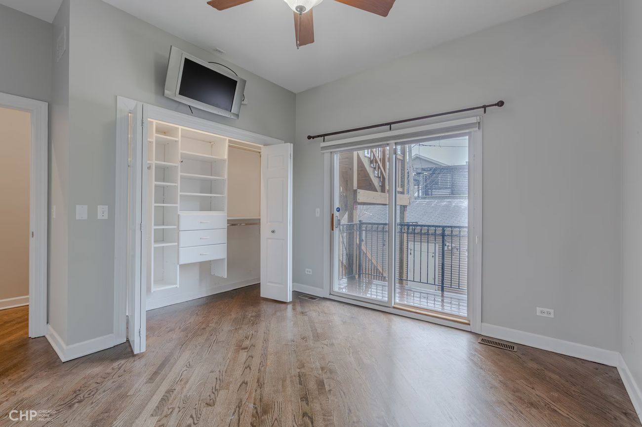 West Lakeview Duplex — bedroom with private deck access